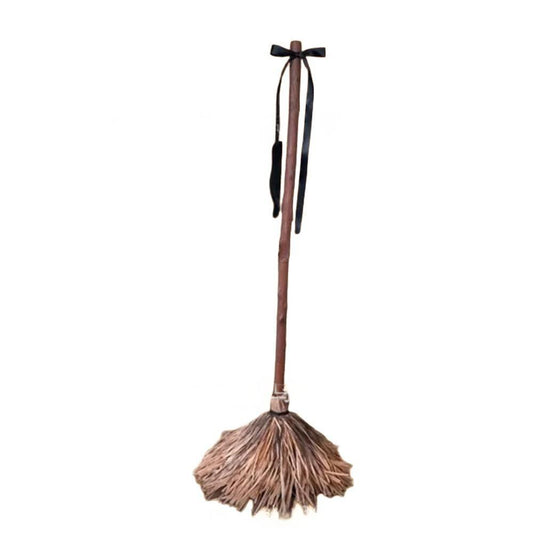 Morroween Sound-Activated Magic Broom - leaning against a doorway