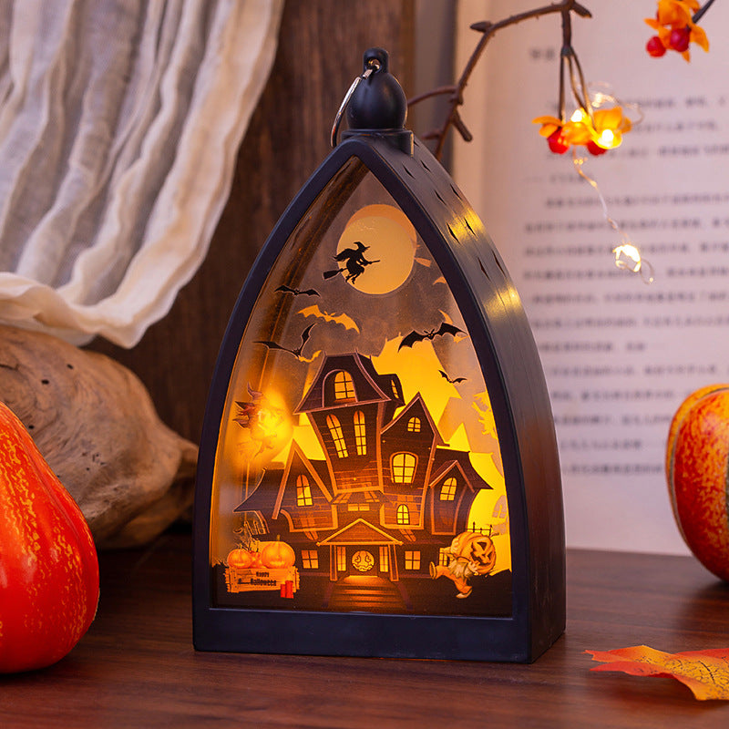 Morroween Glowing Skeleton Castle Lamp - lit on a windowsill at dusk