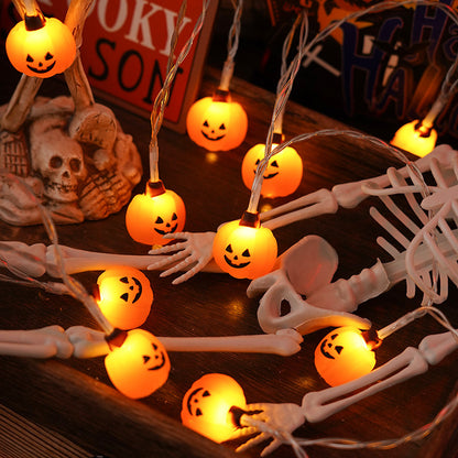 Morroween Pumpkin Bat Ghost Light Chain - draped along a mantel